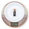 AA battery cal0ries lies in plate on diet scales. low calorie diet concept