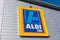 AACHEN, GERMANY FEBRUARY, 2017: Aldi sign south division against blue sky. Aldi is a leading global discount supermarket chain