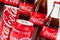 AACHEN, GERMANY OCTOBER, 2017: Several Coca-Cola glass bottles and Cans. Coca-Cola is a carbonated soft drink sold in stores,