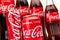 AACHEN, GERMANY OCTOBER, 2017: Various Coca-Cola glass bottles and Cans. Coca-Cola Company is the most popular market leader in