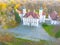 Aaerial view on the beautiful palace in Autumn sunset. White palace in the autumn forest. Close u