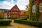 Aalborg, Denmark: Colorful townhouse with an old fountain in the foreground, Aalborg