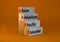 AAPI symbol. Abbreviation AAPI asian american pacific islander on wooden blocks. Beautiful orange background. Copy space. Business