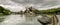 Aarburg village with the caste and church and the river Aare with boats in the foreground