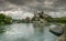 Aarburg village with the caste and church and the river Aare with boats in the foreground