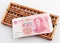 Abacus and china money banknote