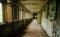 Abadoned school corridor with open windows at Chernobyl city zone of radioactivity ghost town.