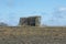 An Abandonded Corn Crib in a Field