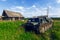 Abandoned all-terrain vehicle. Old village houses. Nature.