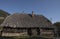 Abandoned alpine wooden hut on a sunny day