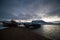 Abandoned, already rotten skeletons of ships lying on the coast of the Arctic ocean against the background