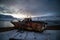 Abandoned, already rotten skeletons of ships lying on the coast of the Arctic ocean against the background