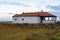 Abandoned ancient church on the Atlantic Ocean coast, Portugal. Medieval catholic church with cross in village.