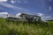 Abandoned antique blue sedan on a hillside near Wymark, SK