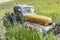 Abandoned antique blue and yellow truck in tall grass near Wymark, SK