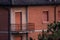 Abandoned apartment with brick facades and closed windows, Italy