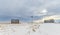 Abandoned Barn, Windmill and House on the Winter Prairie