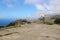 Abandoned Basketball court and hoop above the  famous ruined town Vathia, Peloponnese, Greece.