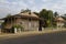 An abandoned beachfront House, with Corrugated metal facings and roof on the Island of Sao Tome.