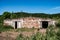 Abandoned brick cowshed