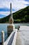 Abandoned bridge going underwater near water dam