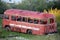 Abandoned broken red bus at Chersky town