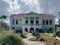 Abandoned building in Downtown Willemsted historic city street colourful buildings with pastel-colored colonial