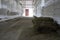 Abandoned building. farm shelter in the barn with haystacks.  Inside a Barn for Farm Animals like Cows or Horses. Interior of Old