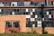 Abandoned Building with Orange Brick Facade and Broken Windows