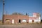 Abandoned building with a patriotic American flag, near the rural town of Carter, Wyoming