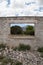 Abandoned building with scenic trees and mountains