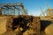 Abandoned bulldozer and derelict buildings