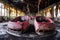 abandoned bumper cars with cracked paint