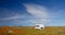 Abandoned camper in California Golden Orange Poppy field during superbloom spring in southern California high desert