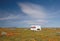 Abandoned camper trailer in California Golden Orange Poppy field during superbloom spring in southern California high desert
