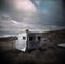 Abandoned caravan falling to pieces in a rural paddock