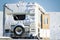 Abandoned caravan mobile home in snow covered field