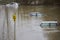 Abandoned Cars Submerged In Flood Water In Parking Lot In Oxfordshire UK January 2024