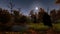 Abandoned cemetery in spooky night forest