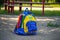 Abandoned childrens backpack in an empty playground