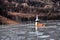 Abandoned church in a mud lake. Natural mining disaster with water pollution