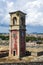 Abandoned clock tower in old fortress in Corfu with panoramic view of Corfu town, Greece