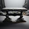 Abandoned coal colored table, against pristine white, a study in contrast
