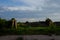 Abandoned concrete silage storage facility. Evening landscape. Abandoned farm buildings