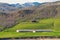 Abandoned dairy farm on green hillside