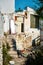 Abandoned desolate rural house entrance exterior with stairs.