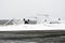 Abandoned destroyed old aircraft in the landfill at the airport in winter.