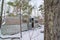 Abandoned dilapidated RV with door open in the woods in rural Northern Wisconsin in winter