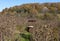 An abandoned drinking water well in a mountain village indicates the absence of signs of human habitation and the use of it as a s