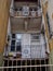 Abandoned empty apartment building with metal fence and balconies with iron railings and security bars on the door in mestre italy